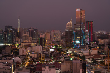 Sunset reflects off skyscrappers in downtown Ho Chi Minh City.