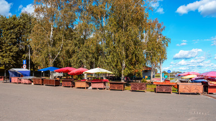 Empty souvenir market of small tourist town at the pier. 