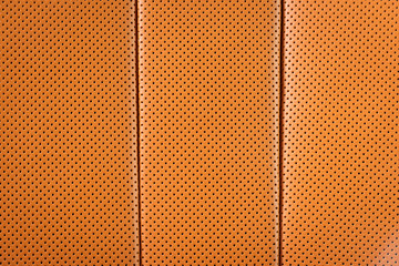 Obraz premium Perforated red leather background