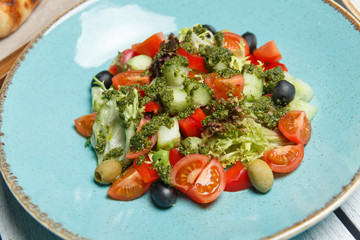 Fresh salad with tomatoes and olives