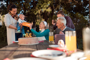 Happy extended family celebrating birthday