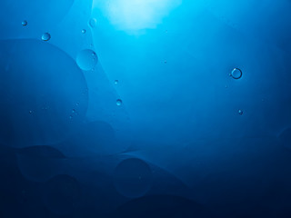 Fototapeta na wymiar Abstract bubble background in blue. Slightly blurred.