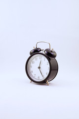 alarm clock in retro style on a white background