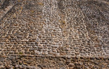 stones laid in sloping wall of Mayan temple 
