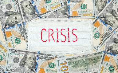 Medical protective mask with the inscription Crisis is on the American dollars.
