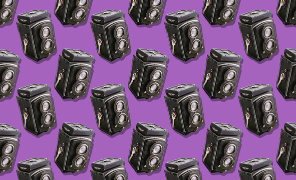 film camera with two lenses medium format on a purple background