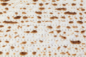 Matzah. Jewish traditional Passover bread. Pesach celebration symbol. With some free space for your text or sign . Close-up.