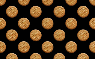 round cookies on a black background pattern
