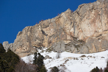 Beautiful mountains covered with snow. Sunny day and blue sky on a frosty day - 338940282