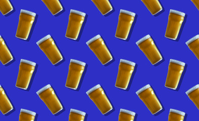 glass of light beer on a blue background pattern