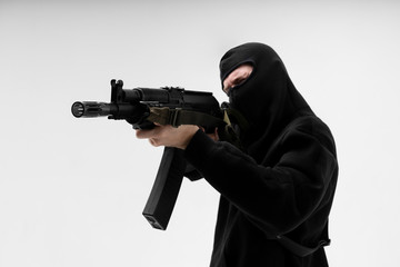 Man in mask With gun on white background - obrazy, fototapety, plakaty
