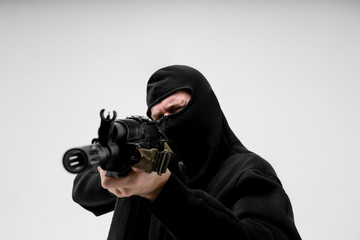 Man in mask With gun on white background