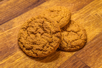 Oatmeal cookies on wooden table or chalkboard. Closeup of oatmeal cookies.