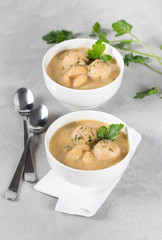 Vegan bean soup-puree with meatballs in a bowl on a light background