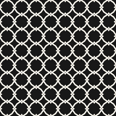 Vector ornamental seamless pattern with carved grid, lattice, mesh, net, repeat geometric tiles. Black and white ornament in Moroccan style. Simple abstract background texture. Elegant dark design