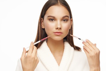 woman applying mascara