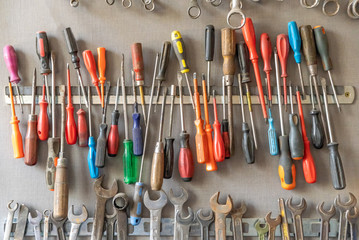 large colorful set of old wrenches and screwdriver in the DIY workshop