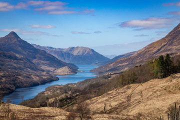 Naklejka na ściany i meble the view over kinlochleven and loch leven in the argyll region of the highlands of scotland during spring shot from the mountains surrounding kinlochleven near the west highland way