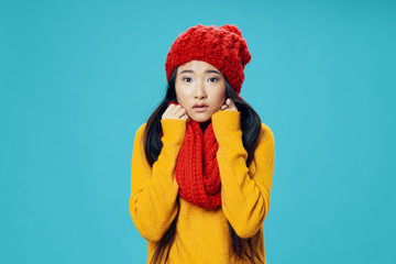 Beautiful woman of Asian appearance red scarf hat cool Studio