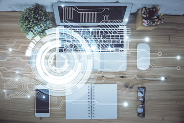 Double exposure of data theme drawing hologram over topview work table background with computer....
