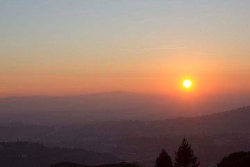Sunset through umbrian hills