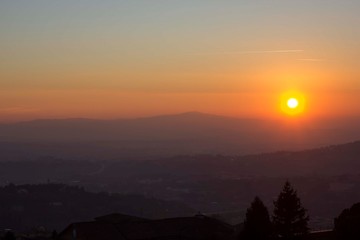 Sunset through umbrian hills
