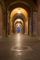 Obraz premium Night view of an historic porch in the cityof Perugia, Italy
