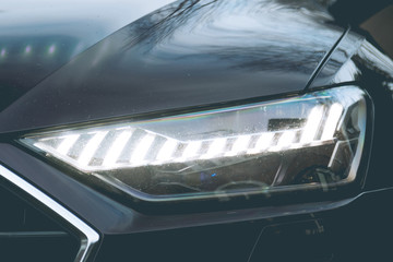 Laser and matrix headlights of a premium car. Close-up. © Dmitry Dven