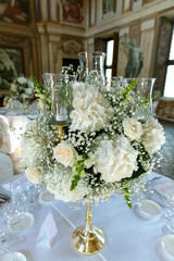 decoration of wedding table. White ranunculus (persian buttercup) in vase