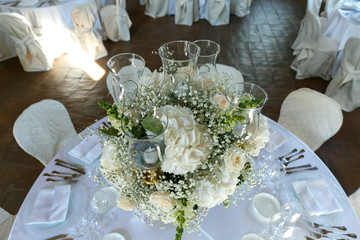 decoration of wedding table. White ranunculus (persian buttercup) in vase