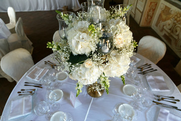 decoration of wedding table. White ranunculus (persian buttercup) in vase