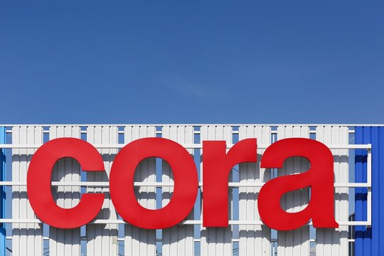 Mondelange, France - May 18, 2015: Cora sign on a facade. Cora is a retail group of hypermarkets located in France and in Europe