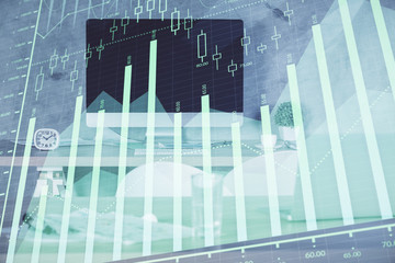 Multi exposure of financial graph drawing and office interior background. Concept of market analysis.