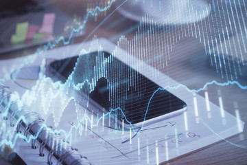 Double exposure of forex chart drawing and cell phone background. Concept of financial data analysis