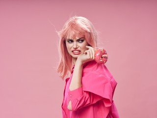 Obraz na płótnie Canvas Beautiful glamorous woman pink hair charm luxury donut