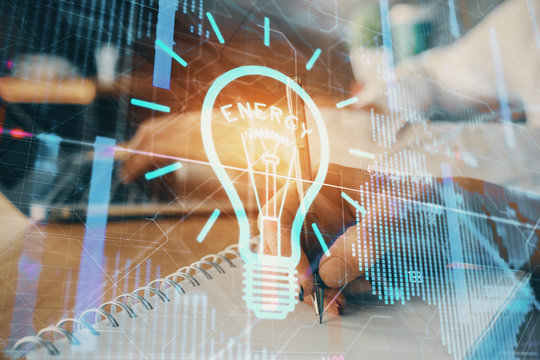 Double exposure of bulb drawing over people taking notes background. Concept of idea