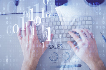 Multi exposure of man's hands typing over computer keyboard and data theme hologram drawing. Top view. Technology concept.