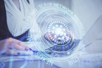 Multi exposure of woman hands working on computer and data theme hologram drawing. Tech concept.