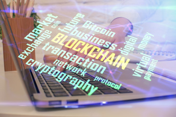 Double exposure of woman hands typing on computer and crypto market theme hologram drawing. Blockchain concept.