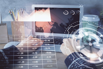 Double exposure of woman hands typing on computer and forex chart hologram drawing. Stock market...