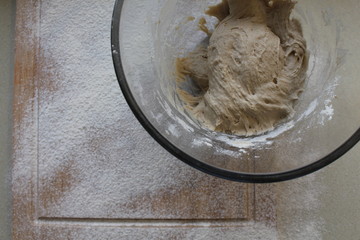 Rye Buckwheat dough rising in a bowl with a flour board dusted and used for baking