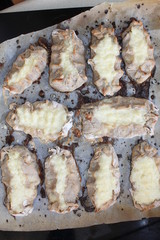 Cooked Karelian pies - Pirakka on a baking sheet. Dish of national cuisine - piirakka. Close-up.