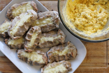 Cooked Karelian pies - Pirakka on a baking sheet. Dish of national cuisine - piirakka. Close-up.