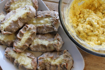 Cooked Karelian pies - Pirakka on a baking sheet. Dish of national cuisine - piirakka. Close-up.