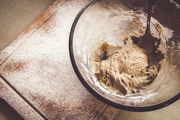 Rye Buckwheat dough rising in a bowl with a flour board dusted and used for baking
