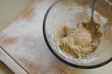 Rye Buckwheat dough rising in a bowl with a flour board dusted and used for baking