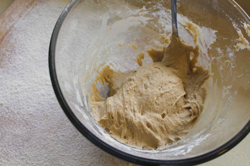 Rye Buckwheat dough rising in a bowl with a flour board dusted and used for baking