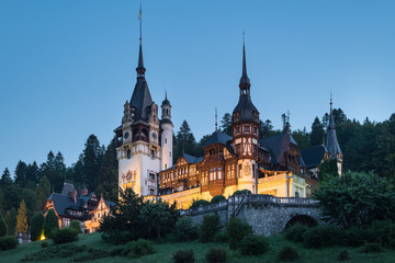Fototapeta na wymiar Peles Castle, famous residence of King Charles I in Sinaia, Romania. Summer landscape at dawn of royal palace and park.