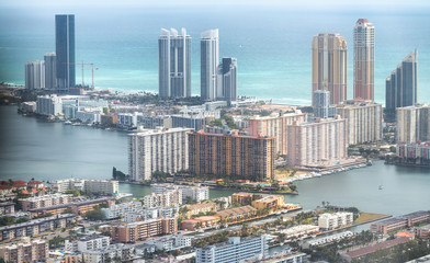 Fototapeta premium North Miami Beach skyscrapers, aerial view from helicopter