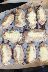 Cooked Karelian pies - Pirakka on a baking sheet. Dish of national cuisine - piirakka. Close-up.